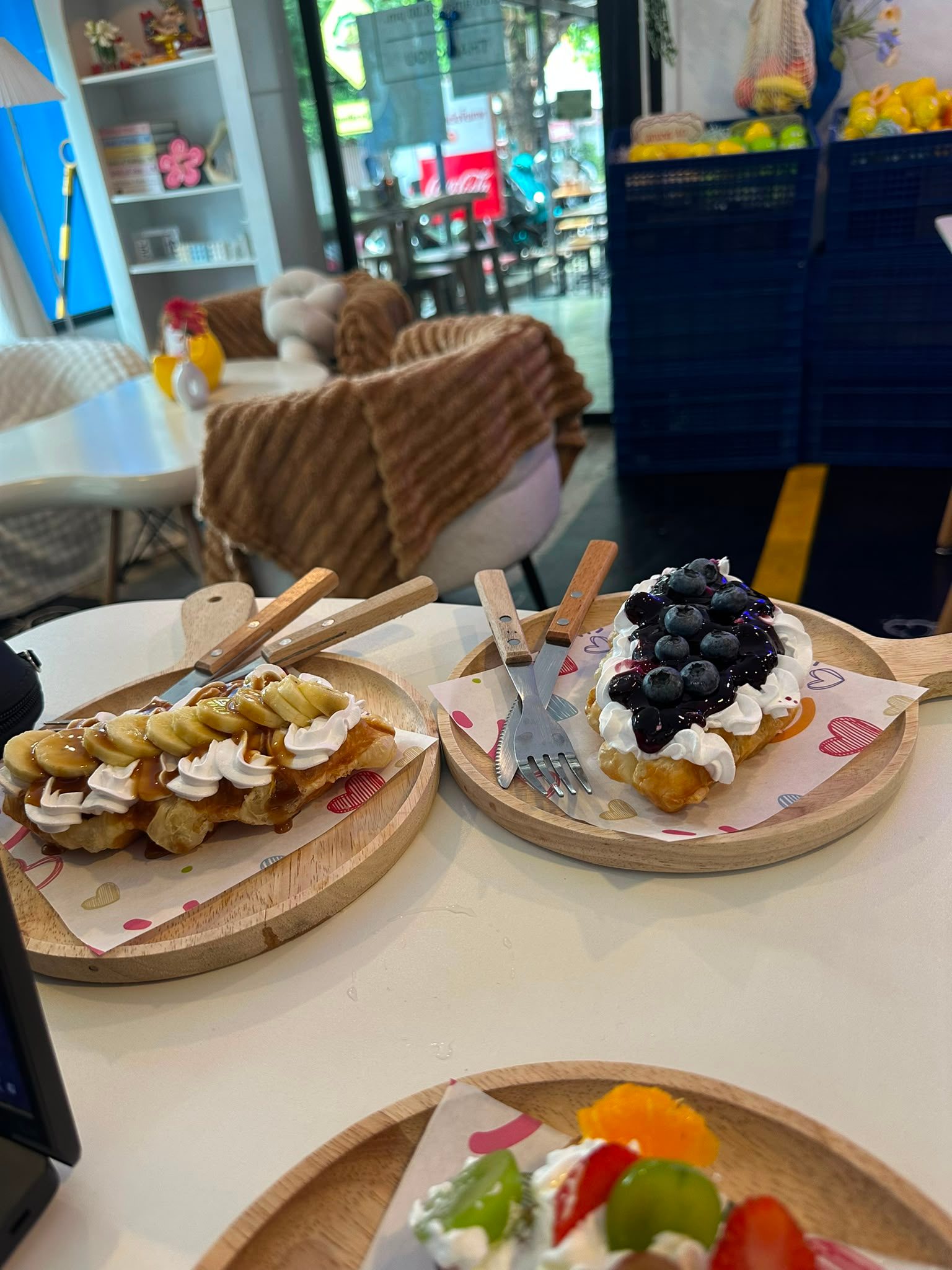 Waffles with banana and blueberry at a café — proper day-off food