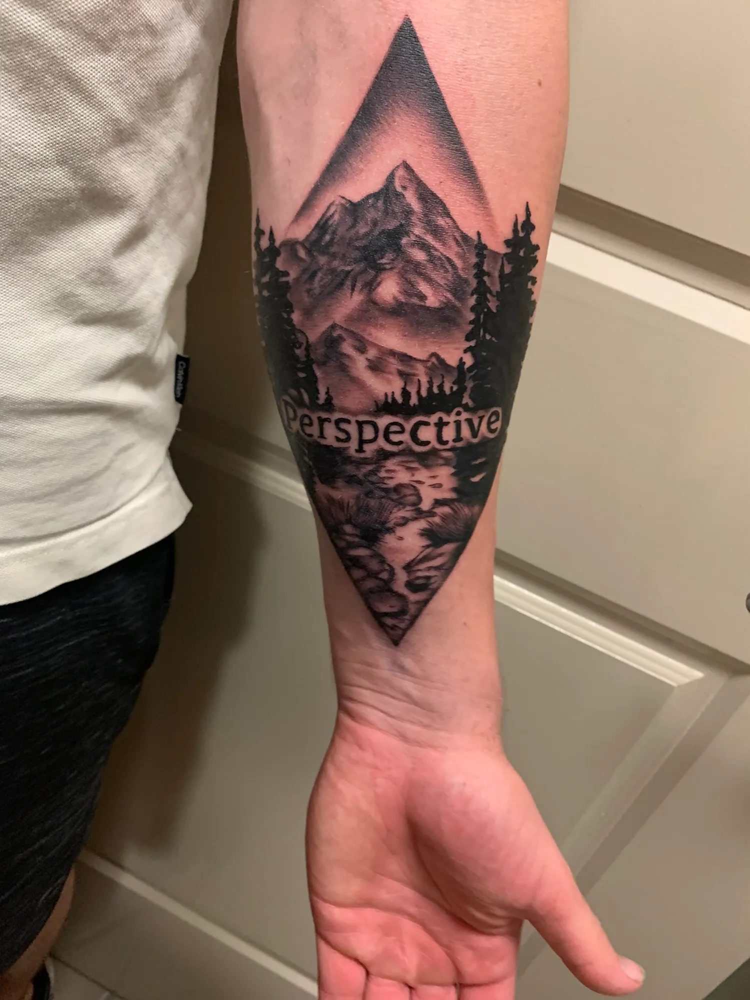 Abstract perspective tattoo, left arm