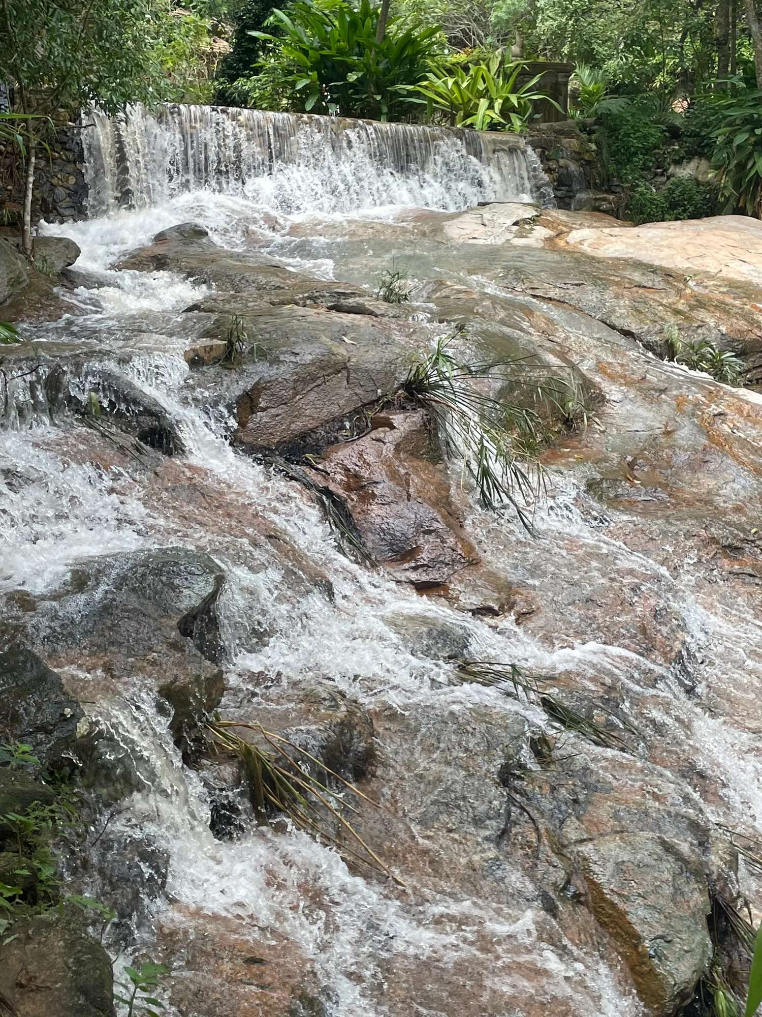 A waterfall running over rock on the Doi Suthep mountainside